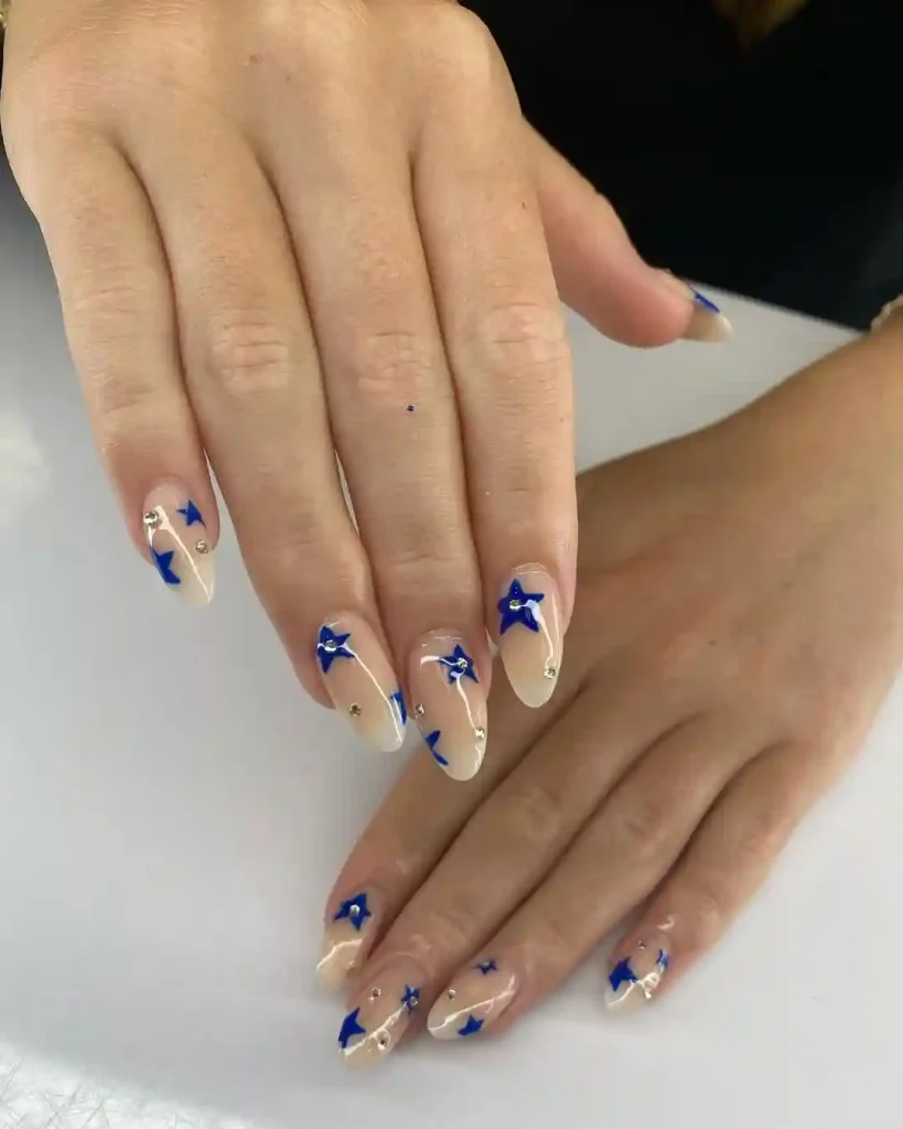 Blue Star Accented Almond Nails