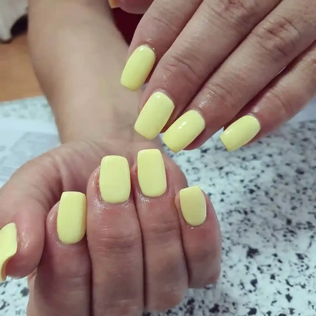 Bright Yellow Almond Nails with Leaf Art