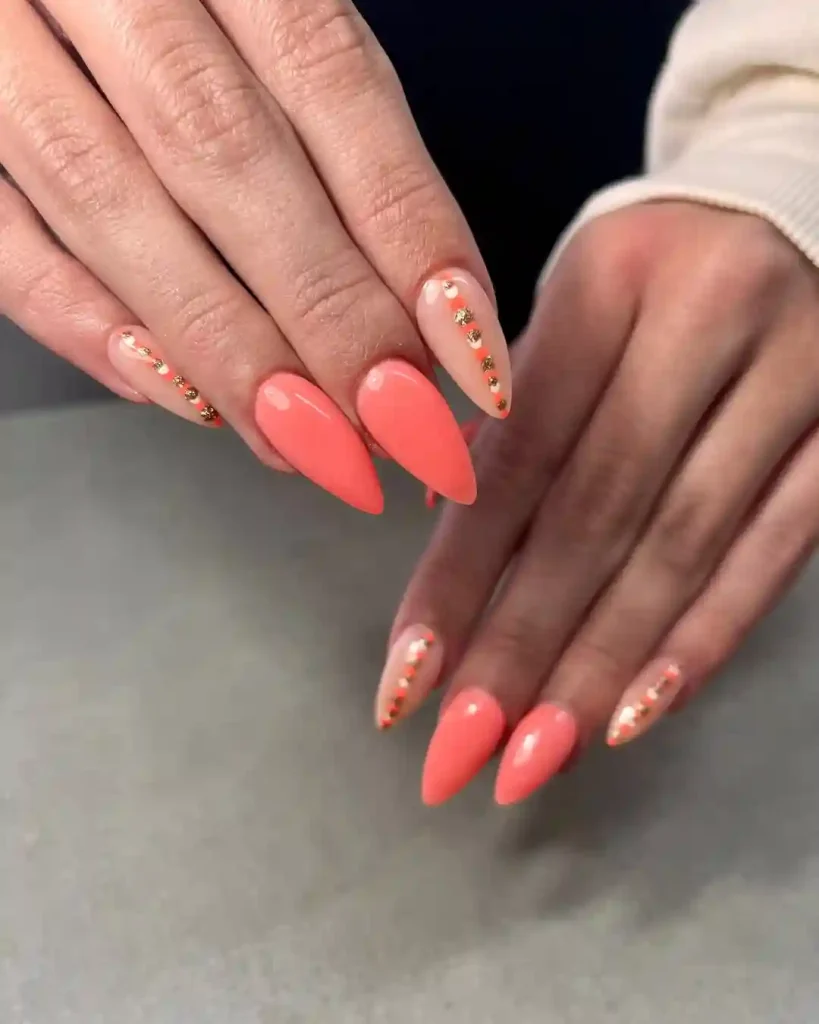 Coral Almond Nails with Gold Stud Accent