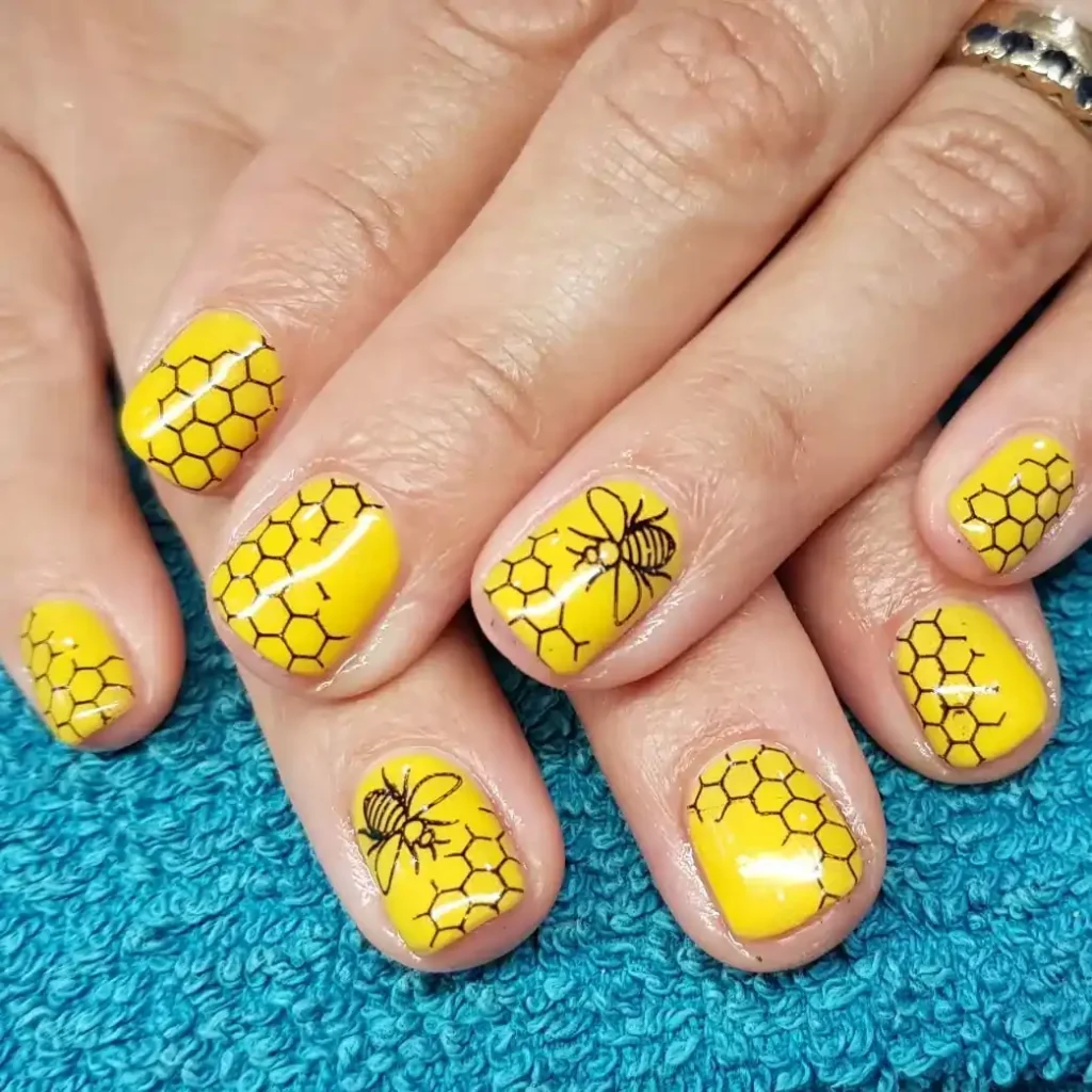 Pastel Yellow Nails with Pink Daisy Tips