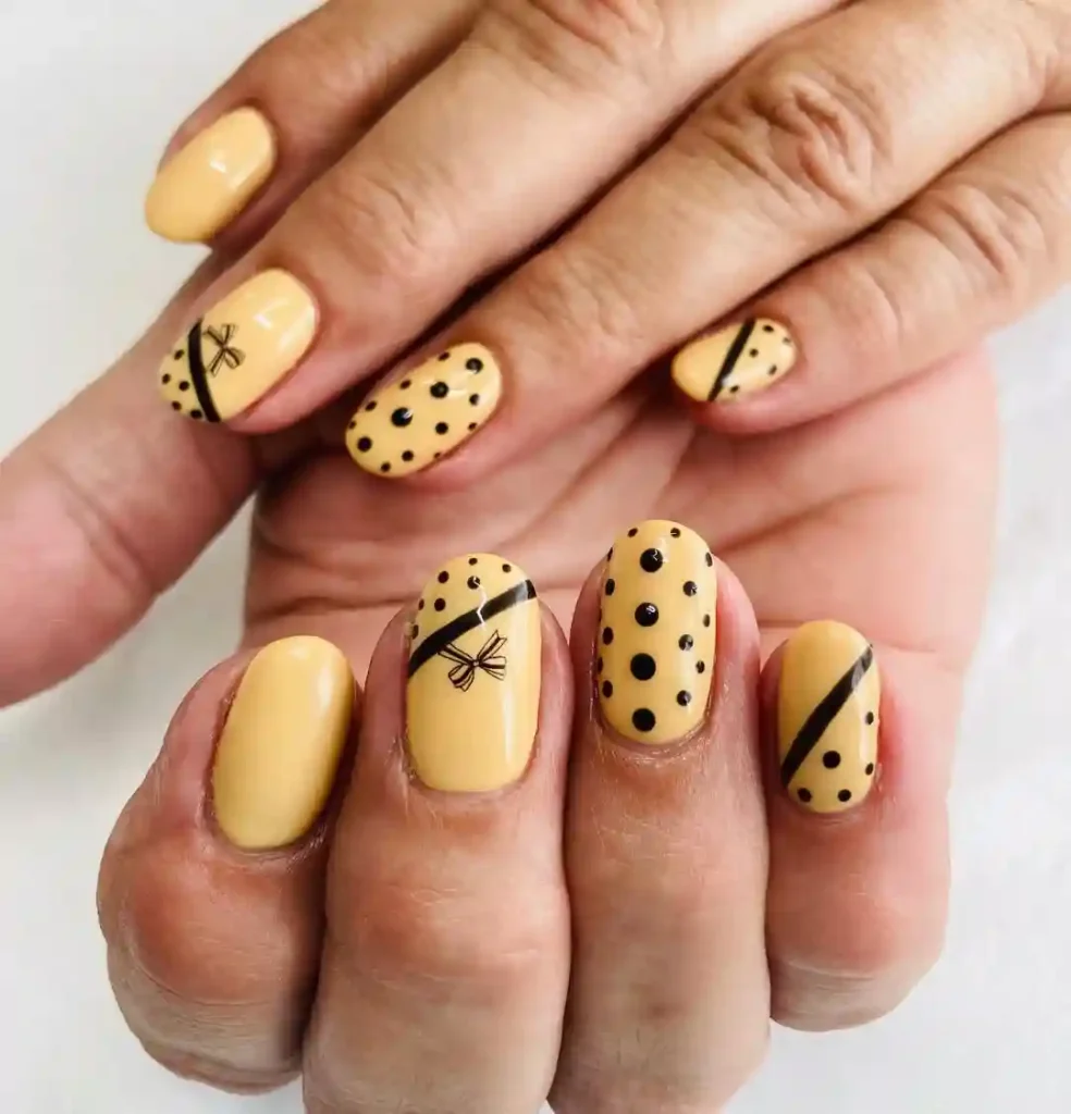 Yellow Polka Dot Nails with Cute Bow Detail