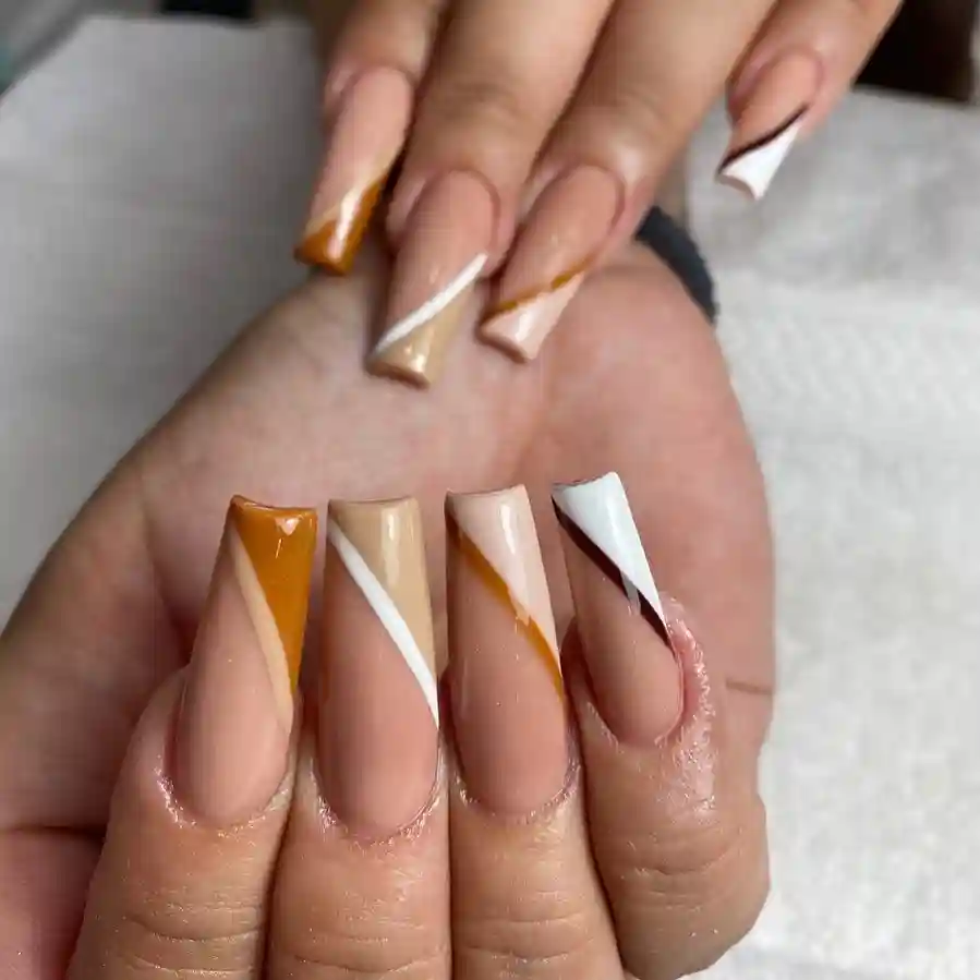 Geometric Nude Coffin Nails with Bold Swirls