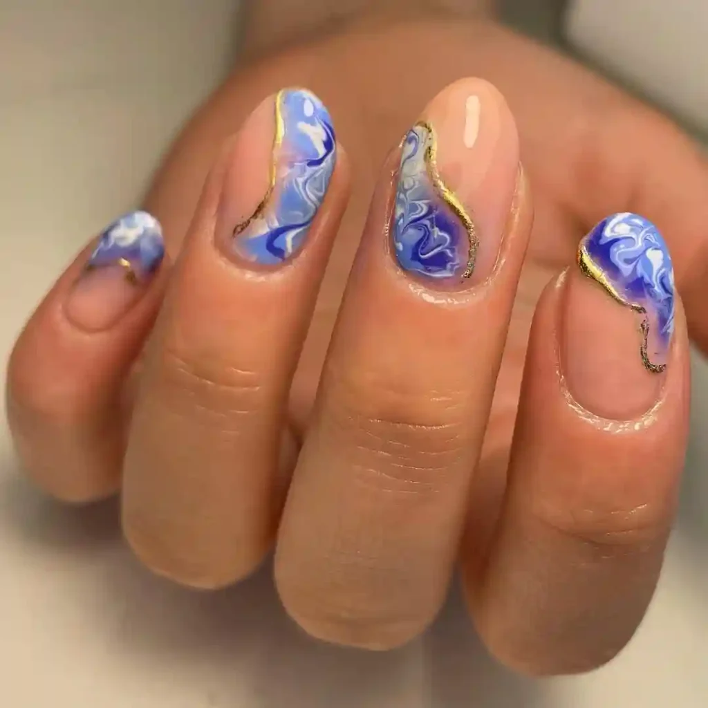 Glossy Blue Sea Nails with Subtle Gold Veins