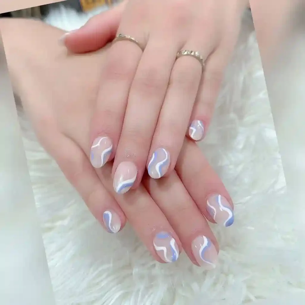 Pastel Swirly White Nails with Blue Accents