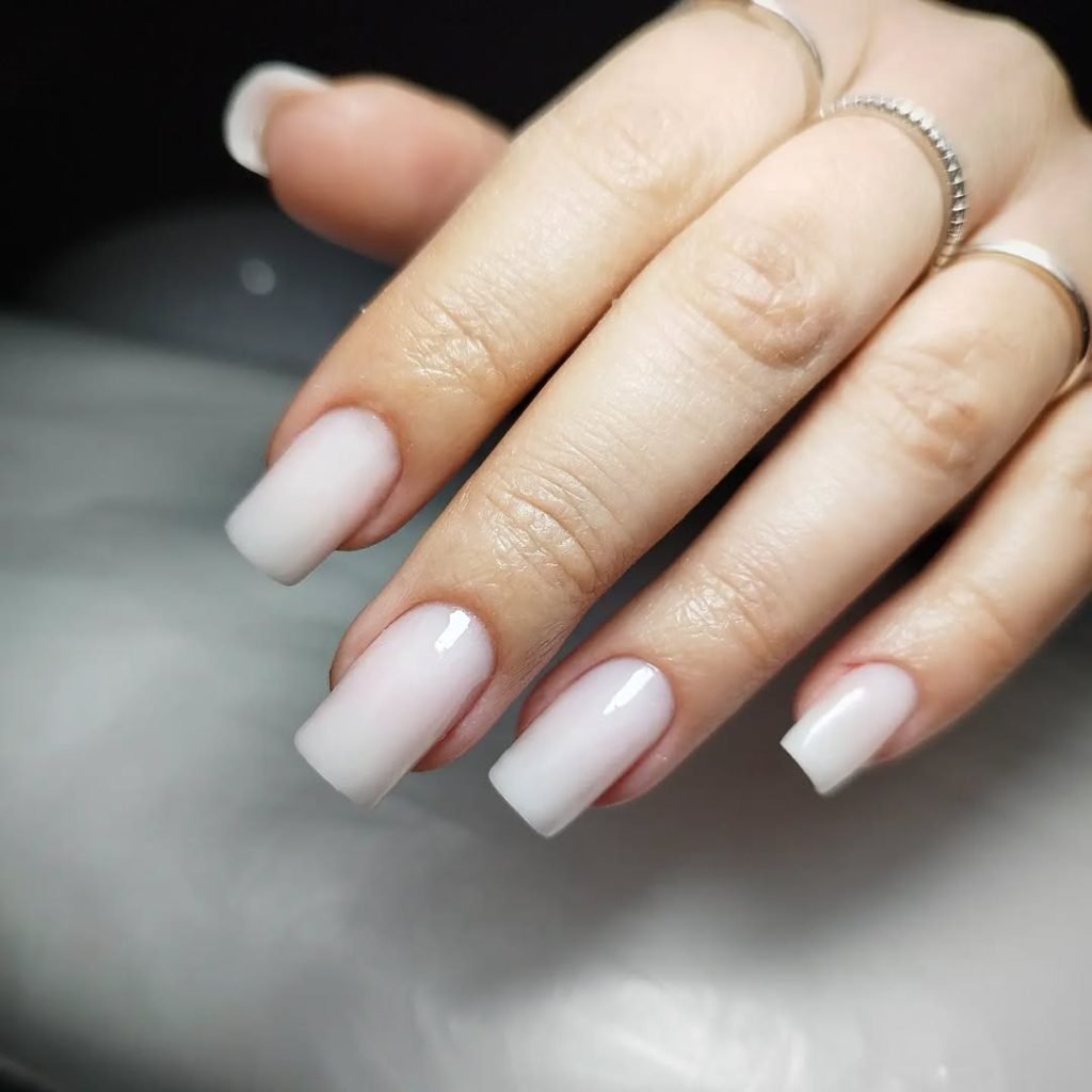Short White Gradient Nails with a Glossy Finish