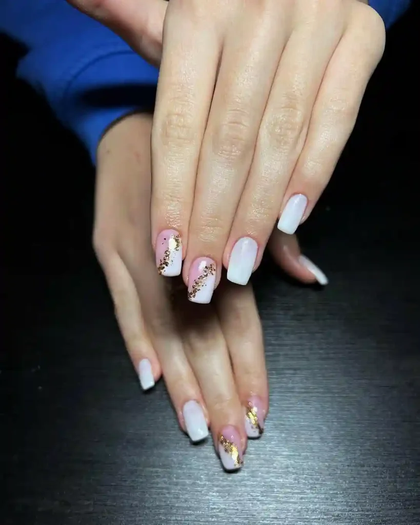 White Ombre Nails with Gold Glitter Flair