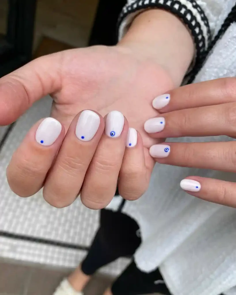 Minimalist White Nails with Tiny Blue Dot Accent